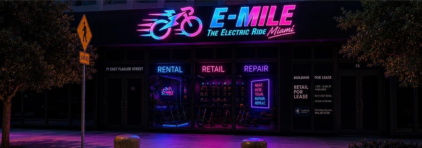 Neon storefront for E-MILE The Electric Ride Miami featuring rental, retail, and repair signs.